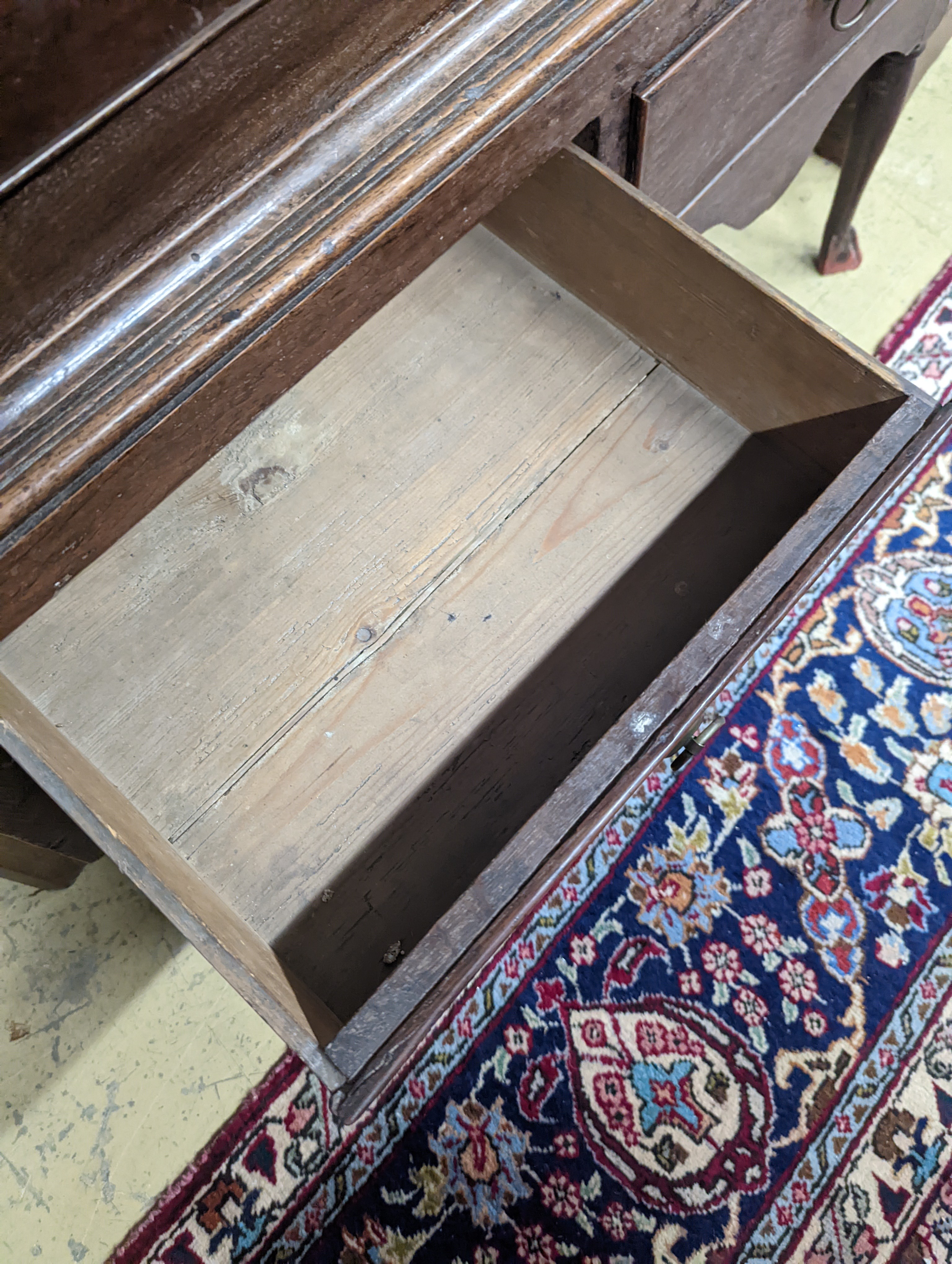 A mid 18th century oak chest on stand, width 89cm, depth 52cm, height 126cm